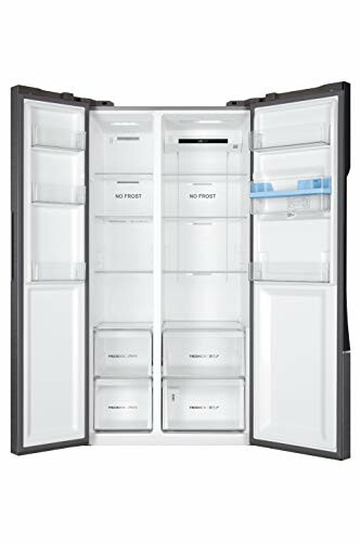 Refrigerador de dos puertas abierto con compartimentos vacíos.
